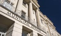 front of the municipal offices against dark blue sky