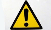 caution sign - black triangle and exclamation mark on yellow back