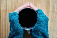 Coffee cup warming hands