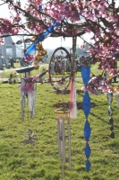 Windchimes in blossom tree at crematorium