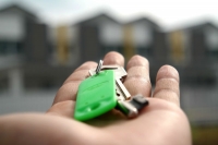 image of a key in someone's hand