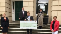 Mayor presents cheque to charity representatives