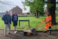 councillors Dobie and Oliver with Ubico operative and weed ripper machine in cheltenham
