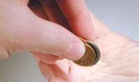 Giving money (courtesy of www.freeimages.co.uk)