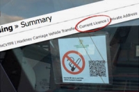 No smoking sticker in a vehicle window which also shows a qr code