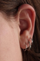 Three ear piercings