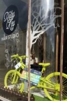 bike painting green in a shop window