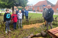 Council officers and school children planting trees for schoos