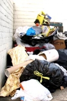bags of rubbish and other items dumped on the street
